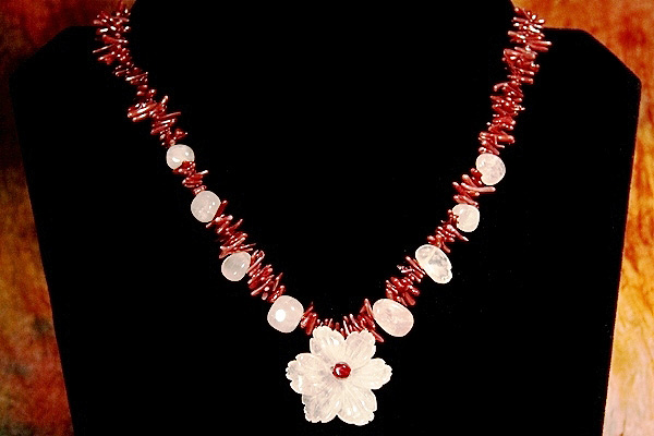 Rose Quartz Flower among Burgundy Coral Thorns