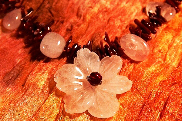 Rose Quartz Flower among Burgundy Coral Thorns