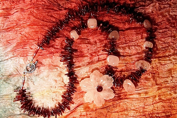 Rose Quartz Flower among Burgundy Coral Thorns